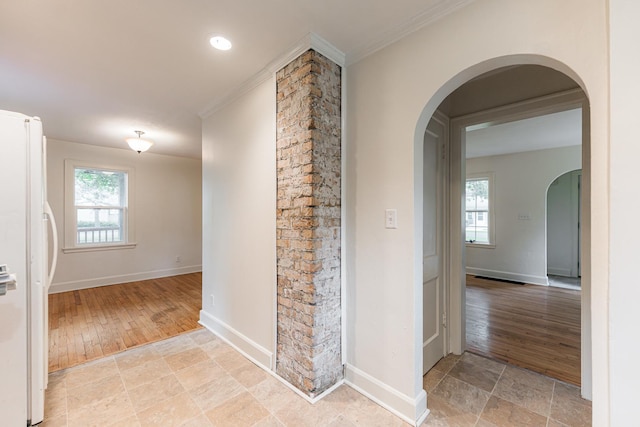 310 Virgil St, Maple Park, IL 60151 - hall featuring arched walkways, healthy amount of natural light, light wood finished floors, and ornamental molding