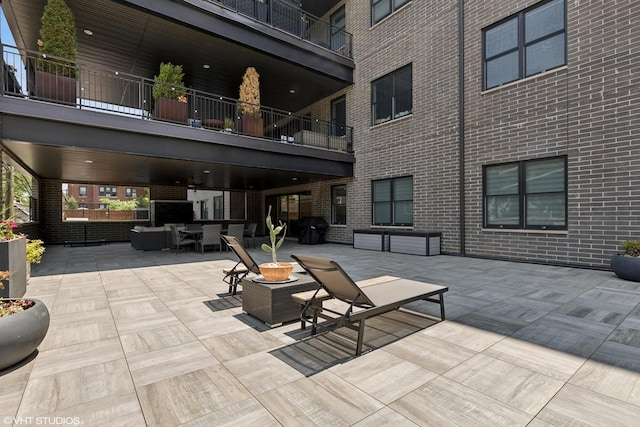 2242 W Lawrence Ave Unit 203, Chicago, IL 60625 - view of patio featuring an outdoor hangout area and area for grilling