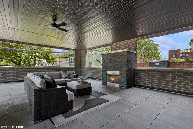 2242 W Lawrence Ave Unit 203, Chicago, IL 60625 - fenced backyard featuring an outdoor living space with a fireplace and a patio area
