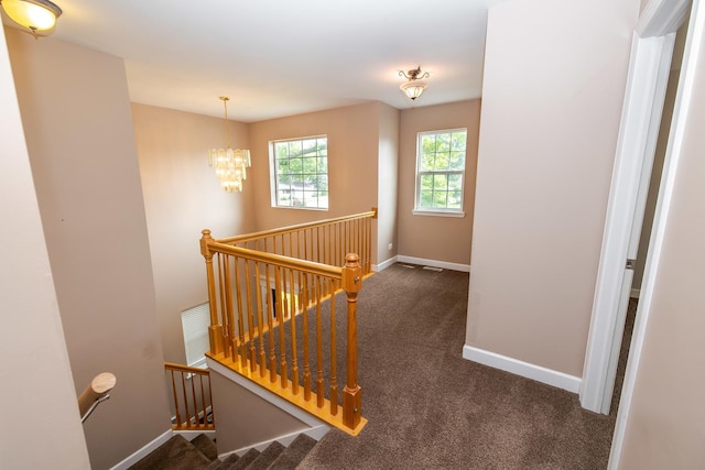 340 Hubbard Ave, Elgin, IL 60123 - stairway featuring carpet floors and a chandelier