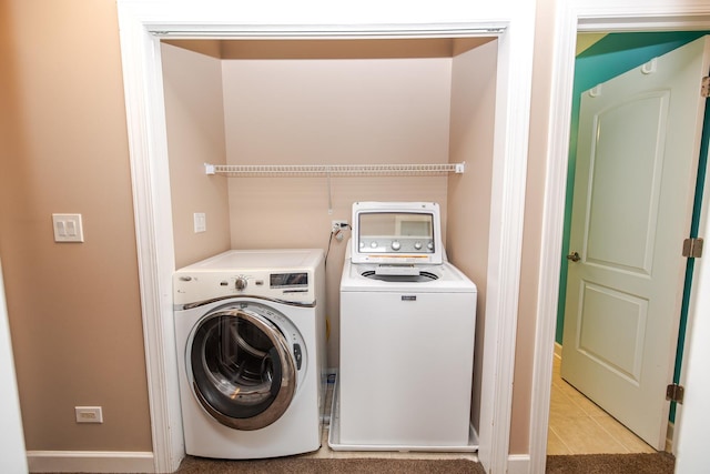 340 Hubbard Ave, Elgin, IL 60123 - laundry room with washing machine and clothes dryer and light tile patterned floors