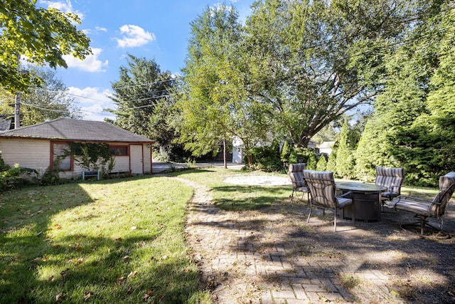 808 Glenwood Ave, Joliet, IL 60435 - view of grassy yard with a fire pit