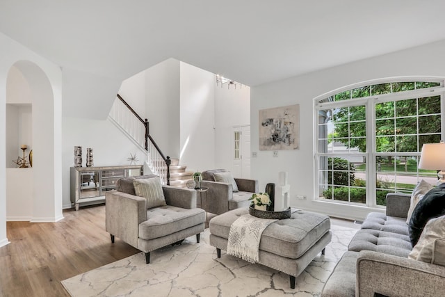 7612 Cascade Way, Gurnee, IL 60031 - living room with wood finished floors, stairway, and arched walkways