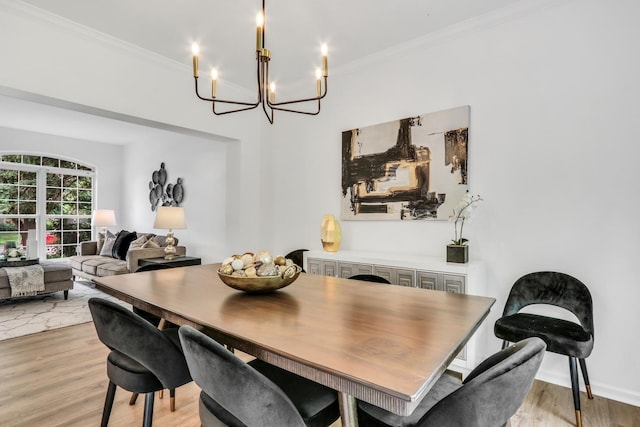 7612 Cascade Way, Gurnee, IL 60031 - dining area featuring a chandelier, light wood-type flooring, and crown molding