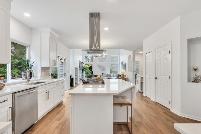 7612 Cascade Way, Gurnee, IL 60031 - kitchen featuring stainless steel appliances, a center island, light wood finished floors, white cabinetry, and recessed lighting