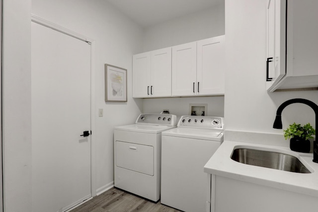 7612 Cascade Way, Gurnee, IL 60031 - laundry area featuring independent washer and dryer, cabinet space, and light wood-type flooring