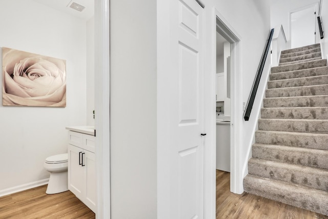 7612 Cascade Way, Gurnee, IL 60031 - staircase featuring wood finished floors