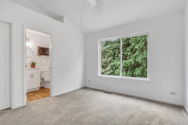 7612 Cascade Way, Gurnee, IL 60031 - unfurnished bedroom with carpet floors, vaulted ceiling, ensuite bathroom, and a ceiling fan