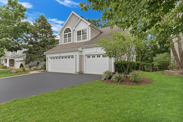 7612 Cascade Way, Gurnee, IL 60031 - view of front of house with driveway, a front lawn, roof with shingles, and a garage