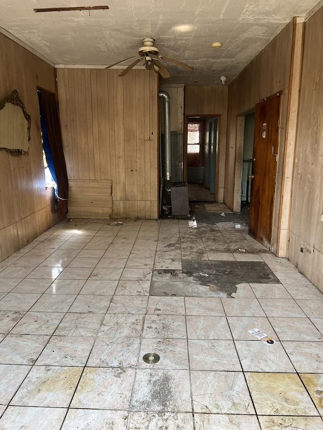 2431 W Taylor St, Chicago, IL 60612 - spare room with wooden walls and a ceiling fan