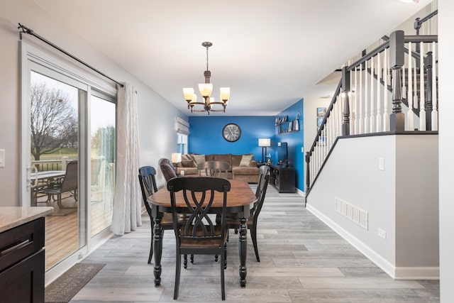 1792 Autumn Woods Ln, Romeoville, IL 60446 - dining room featuring stairs, a chandelier, and light wood-style floors