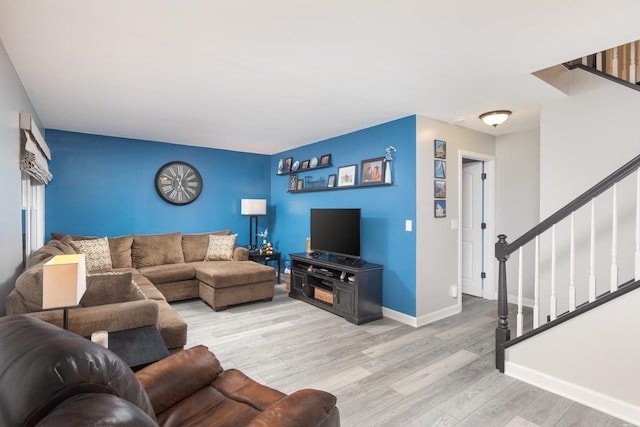 1792 Autumn Woods Ln, Romeoville, IL 60446 - living room featuring light wood-type flooring, stairs, and an accent wall