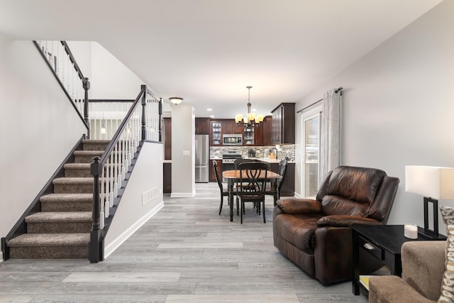 1792 Autumn Woods Ln, Romeoville, IL 60446 - living area with a chandelier, stairs, light wood-type flooring, and recessed lighting