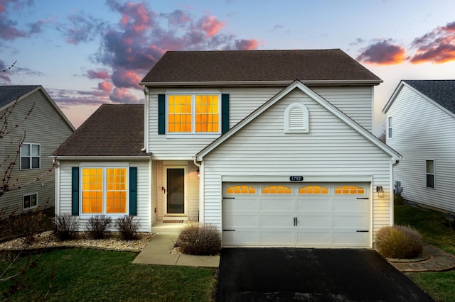 1792 Autumn Woods Ln, Romeoville, IL 60446 - traditional-style home with driveway, roof with shingles, a garage, and a front lawn