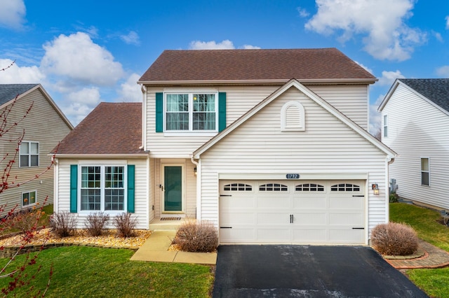 1792 Autumn Woods Ln, Romeoville, IL 60446 - traditional-style home with asphalt driveway, a front lawn, a garage, and a shingled roof