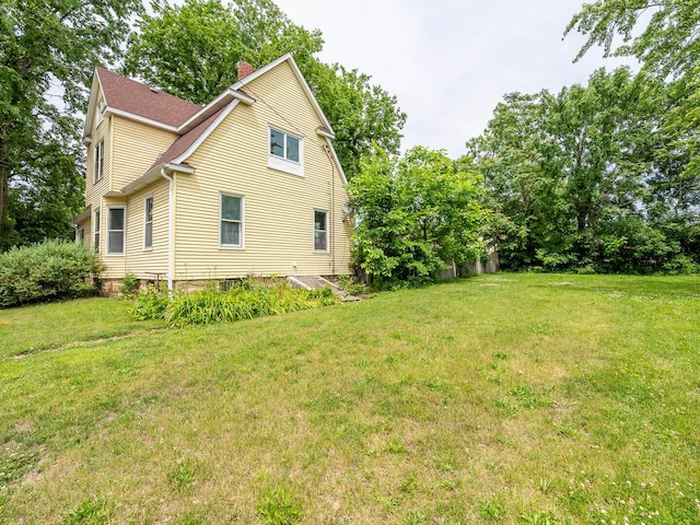 514 N St, Crete, IL 60417 - view of home's exterior featuring a yard and a chimney