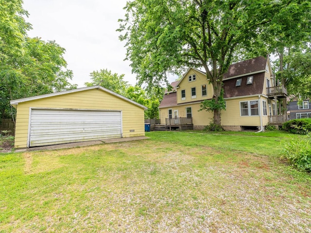 514 N St, Crete, IL 60417 - view of grassy yard featuring an outbuilding, a detached garage, and a wooden deck