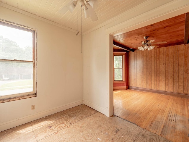 514 N St, Crete, IL 60417 - empty room with ceiling fan, light wood-style floors, wooden walls, wooden ceiling, and crown molding
