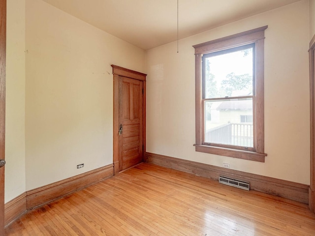 514 N St, Crete, IL 60417 - unfurnished room with light wood-style floors and baseboards
