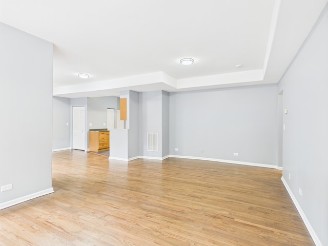 1729 E 67th St Unit 2E, Chicago, IL 60649 - unfurnished room featuring light wood-type flooring and baseboards