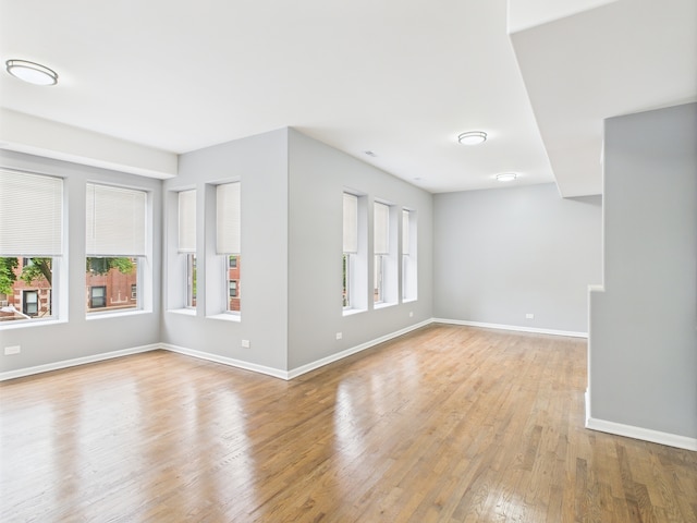 1729 E 67th St Unit 2E, Chicago, IL 60649 - spare room with light wood finished floors and baseboards