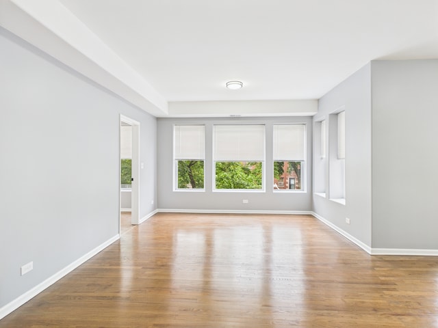 1729 E 67th St Unit 2E, Chicago, IL 60649 - unfurnished room with wood finished floors and baseboards