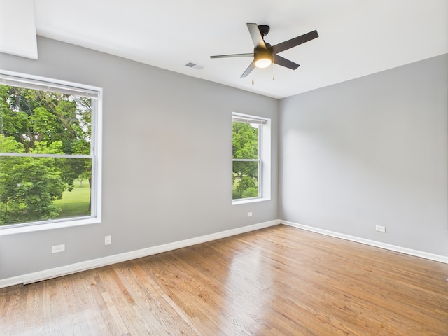 1729 E 67th St Unit 2E, Chicago, IL 60649 - spare room featuring ceiling fan and light wood-style floors