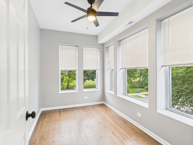 1729 E 67th St Unit 2E, Chicago, IL 60649 - empty room with light wood-style flooring and a ceiling fan