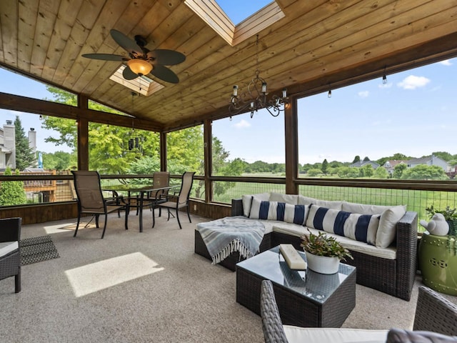 569 Ryan Way, Crystal Lake, IL 60012 - sunroom featuring outdoor lounge area, a ceiling fan, a skylight, outdoor dining space, and lofted ceiling