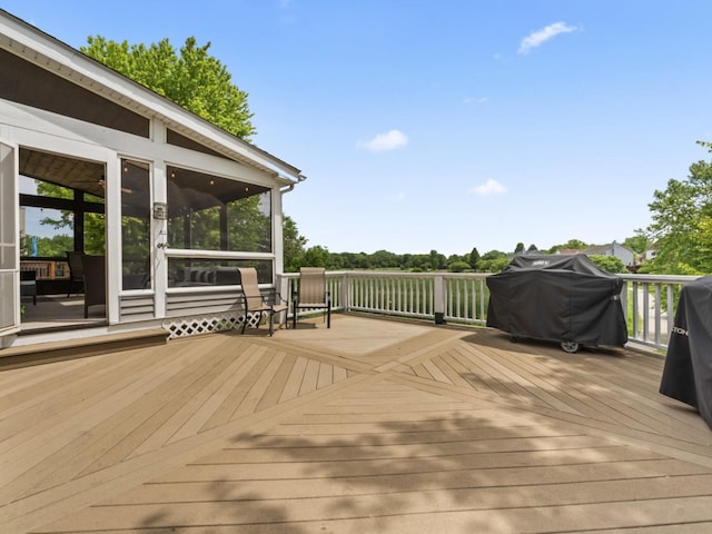 569 Ryan Way, Crystal Lake, IL 60012 - wooden deck with area for grilling and a sunroom