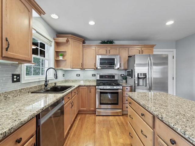 569 Ryan Way, Crystal Lake, IL 60012 - kitchen featuring appliances with stainless steel finishes, light wood-style floors, light stone countertops, backsplash, and recessed lighting