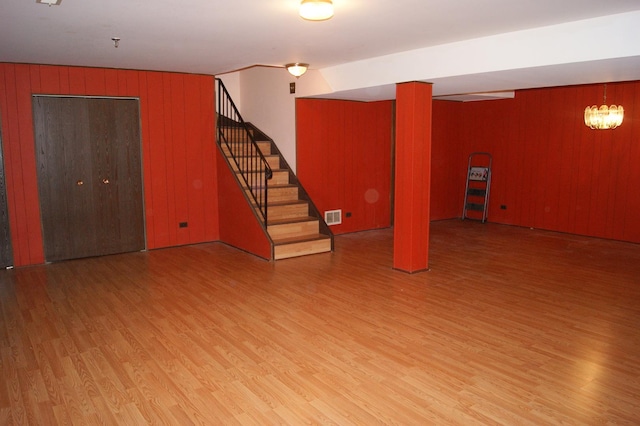 4184 Cove Ln Unit D, Glenview, IL 60025 - finished below grade area with wood finished floors, wooden walls, and stairs