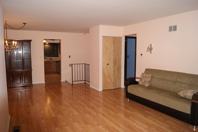 4184 Cove Ln Unit D, Glenview, IL 60025 - living room with wood finished floors and a chandelier