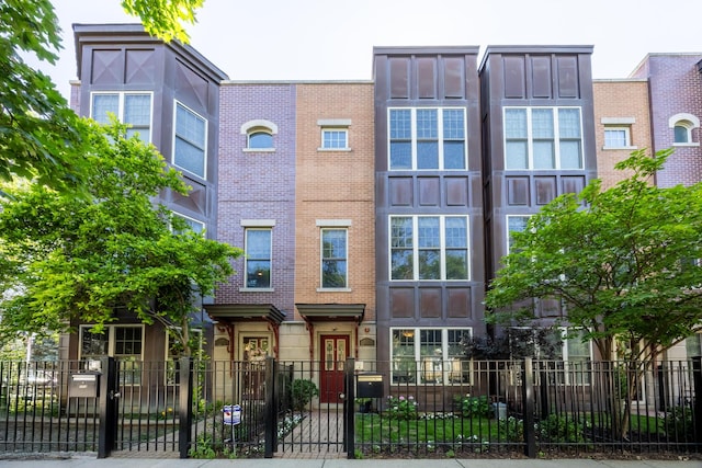 3457 N Whipple St, Chicago, IL 60618 - view of property featuring a fenced front yard, a gate, and brick siding