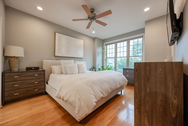 3457 N Whipple St, Chicago, IL 60618 - bedroom with light wood-style floors, recessed lighting, and a ceiling fan