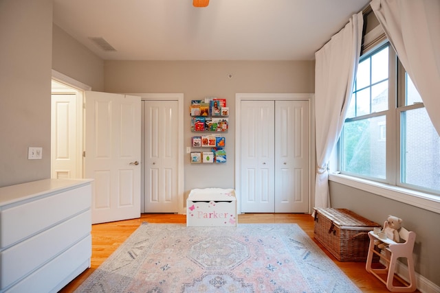 3457 N Whipple St, Chicago, IL 60618 - bedroom with multiple closets and light wood-style floors