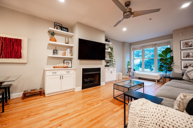 3457 N Whipple St, Chicago, IL 60618 - living area featuring ceiling fan, light wood finished floors, a fireplace, and recessed lighting