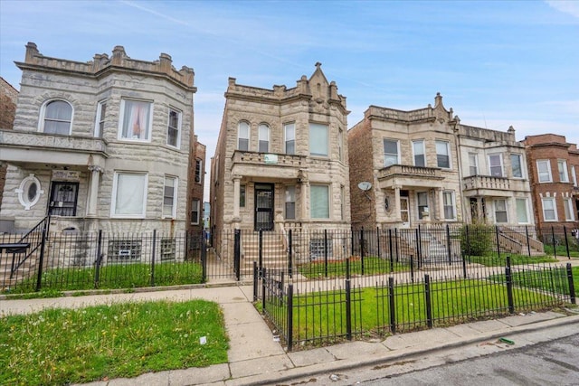 4336 W Adams St, Chicago, IL 60624 - multi unit property featuring a fenced front yard and stone siding