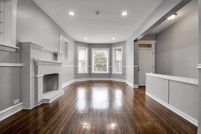4336 W Adams St, Chicago, IL 60624 - unfurnished living room with wood finished floors, a brick fireplace, and recessed lighting