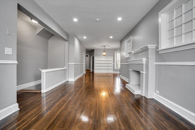 4336 W Adams St, Chicago, IL 60624 - unfurnished living room with wood finished floors, recessed lighting, and a fireplace with raised hearth