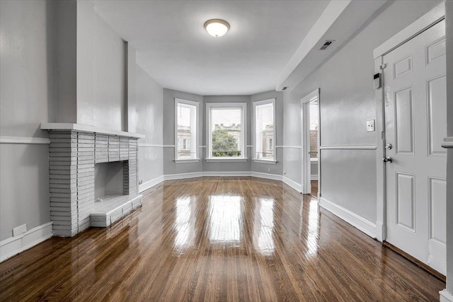 4336 W Adams St, Chicago, IL 60624 - unfurnished living room with wood finished floors and a fireplace