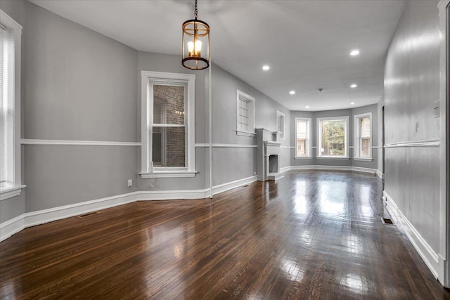 4336 W Adams St, Chicago, IL 60624 - unfurnished living room featuring a fireplace, wood finished floors, recessed lighting, and a chandelier