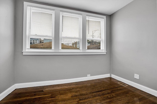 4336 W Adams St, Chicago, IL 60624 - empty room with baseboards and dark wood-style flooring