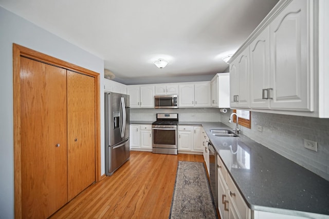 2870 Gannet Ln, New Lenox, IL 60451 - kitchen with appliances with stainless steel finishes, light wood-type flooring, decorative backsplash, and white cabinetry
