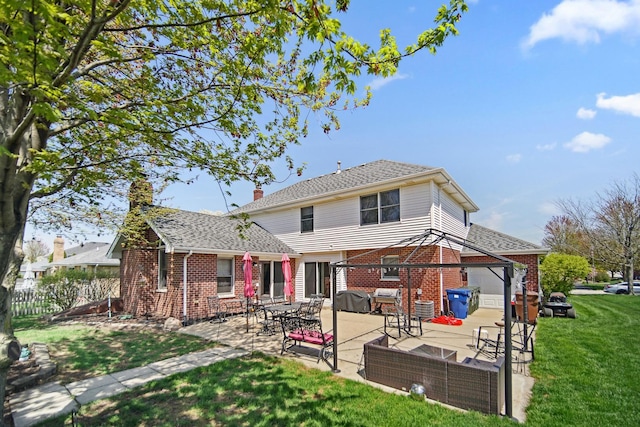 2870 Gannet Ln, New Lenox, IL 60451 - back of house featuring brick siding, a patio, an attached garage, and a chimney