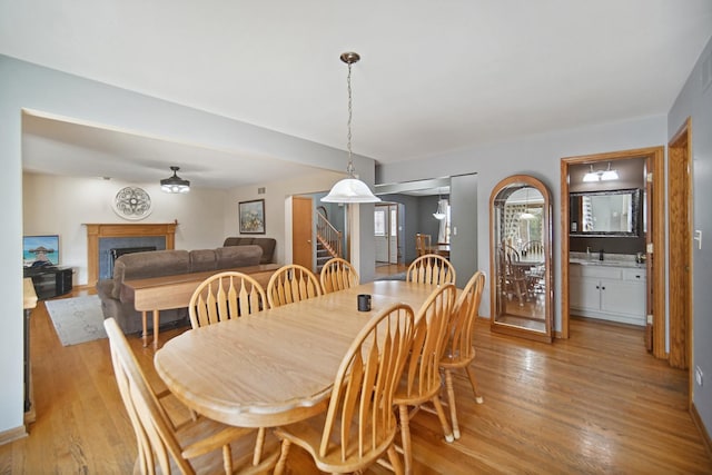 2870 Gannet Ln, New Lenox, IL 60451 - dining area featuring light wood-style floors and a fireplace
