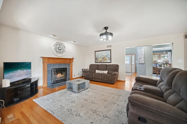 2870 Gannet Ln, New Lenox, IL 60451 - living room featuring wood finished floors and a tiled fireplace