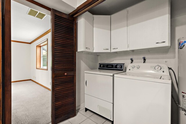189 Oakview Dr, New Lenox, IL 60451 - laundry area featuring cabinet space, washer and clothes dryer, water heater, light colored carpet, and ornamental molding