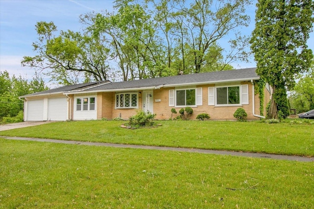 549 Allen Ln, University Park, IL 60484 - ranch-style house with a garage, concrete driveway, a front yard, and brick siding
