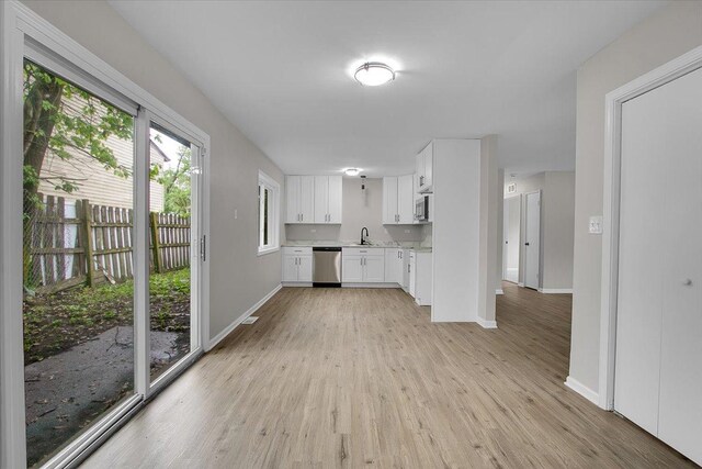 549 Allen Ln, University Park, IL 60484 - kitchen with stainless steel appliances, light wood finished floors, light countertops, and white cabinets